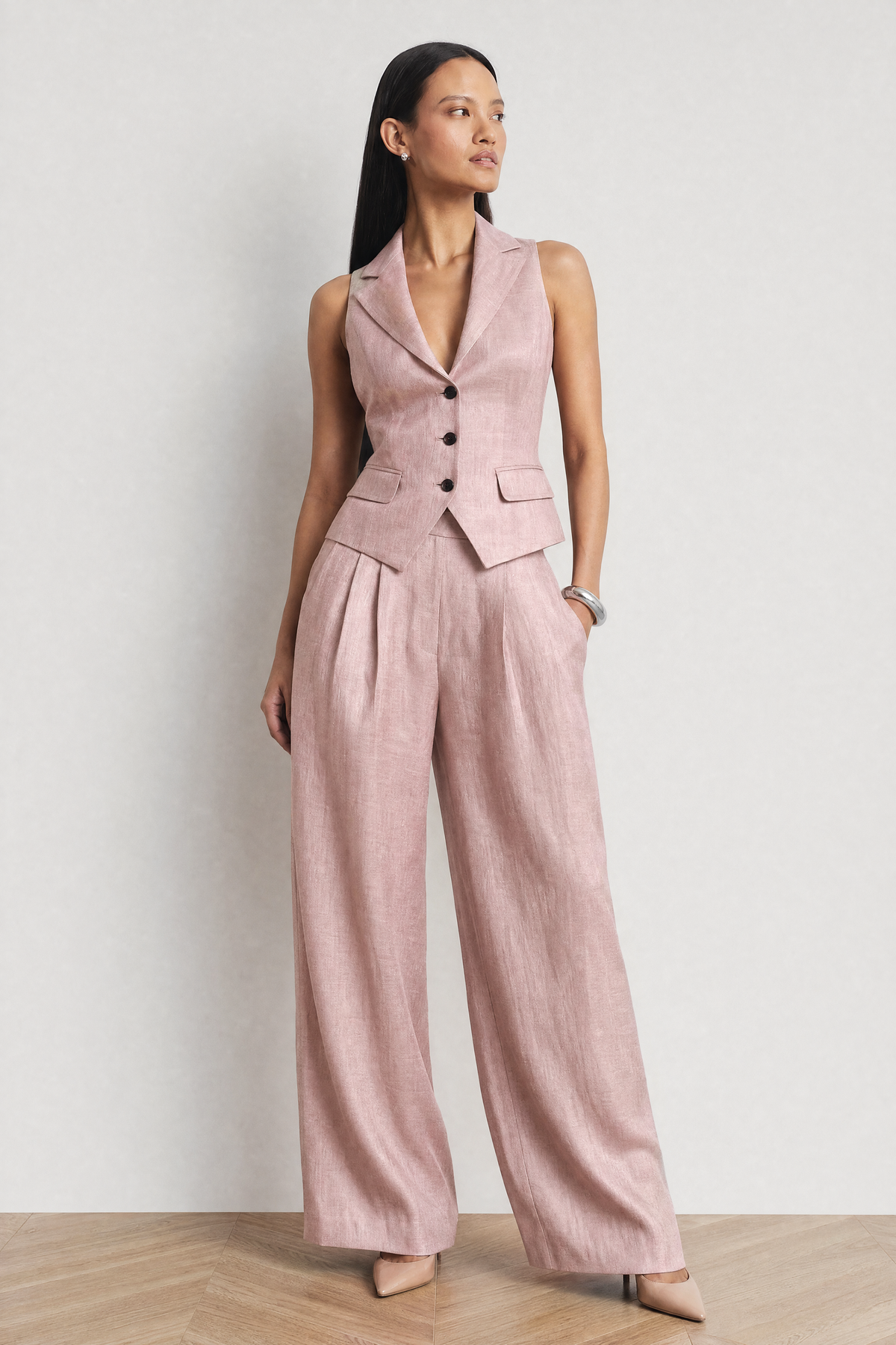 The Soleil Sleeveless Waistcoat & Wide-Leg Trouser Set in blush pink - angled view